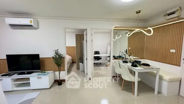 Modern open-plan living room with dining area and stylish decor