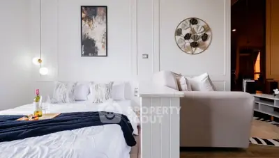 Modern studio apartment with cozy bed and stylish decor