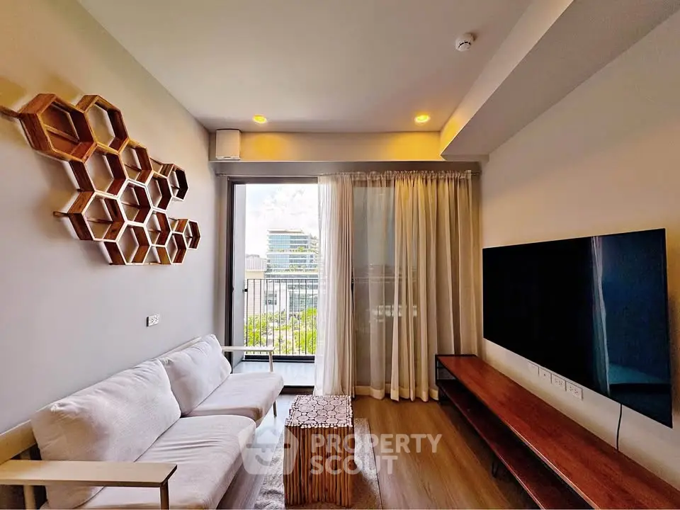 Modern living room with stylish decor and balcony view