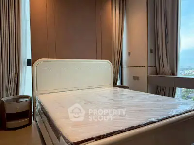 Luxurious bedroom with elegant bed and panoramic city view, perfect for serene living.