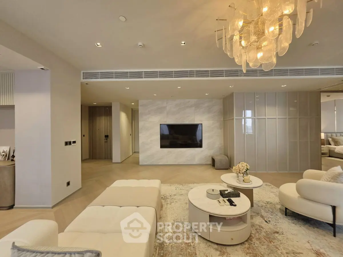 Luxurious modern living room with elegant chandelier and stylish furniture