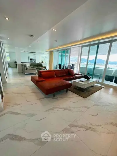 Luxurious open-plan living room with stunning views and modern furnishings