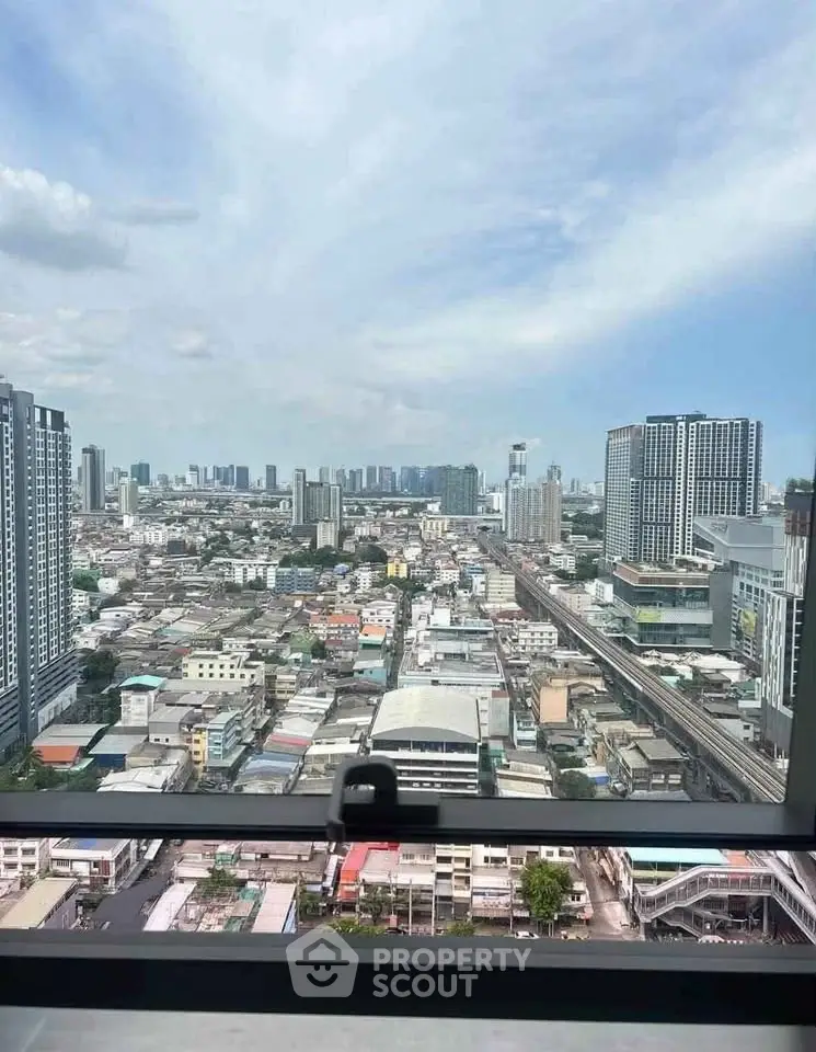 Stunning cityscape view from high-rise apartment window, showcasing urban skyline and vibrant city life.