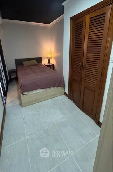 Cozy bedroom with modern design and ample natural light