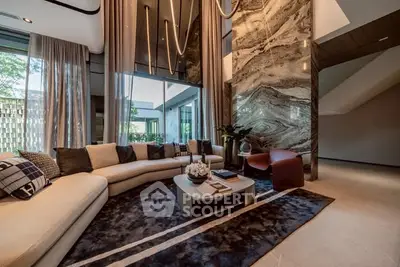 Luxurious modern living room with high ceilings and elegant decor