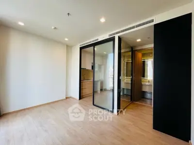 Spacious modern apartment with open layout and sleek wooden flooring