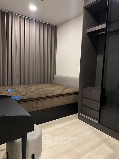 Modern bedroom with stylish furniture and elegant curtains, perfect for a cozy living experience.