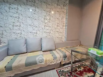 Stylish living room with modern sofa and marble accent wall