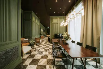 Luxurious living room with elegant decor and stylish lighting, featuring a spacious dining area.