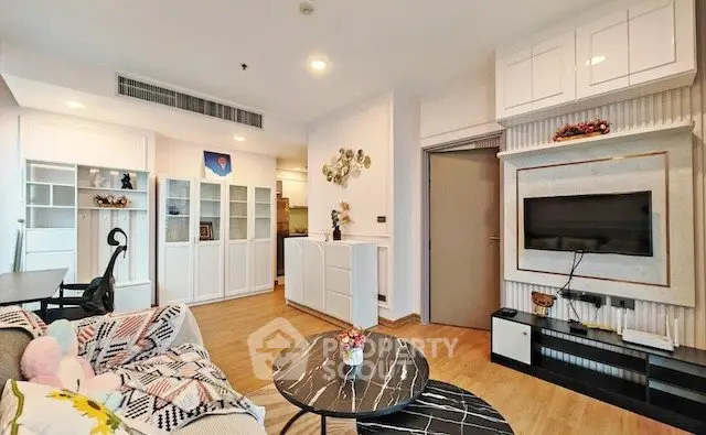 Modern living room with stylish decor and built-in storage in a cozy apartment.