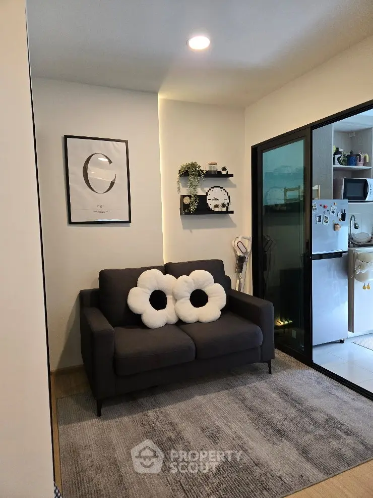 Cozy living room with modern decor and open kitchen view