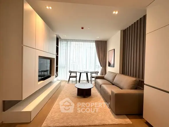 Modern living room with sleek design, featuring a cozy sofa, stylish coffee table, and large windows with city view.