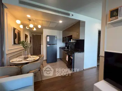 Modern open-layout kitchen with dining area and stylish decor