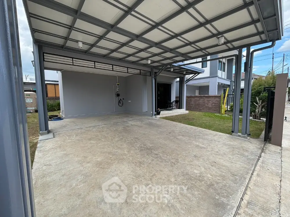 Spacious modern carport with covered roof and adjacent lawn area