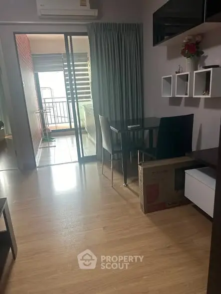 Modern apartment dining area with balcony view and stylish decor