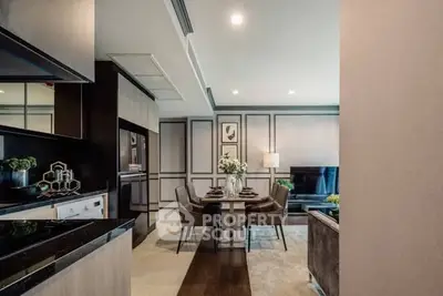 Modern open-plan living and dining area with elegant decor and sleek finishes.