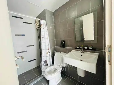 Modern bathroom with sleek gray tiles and stylish fixtures
