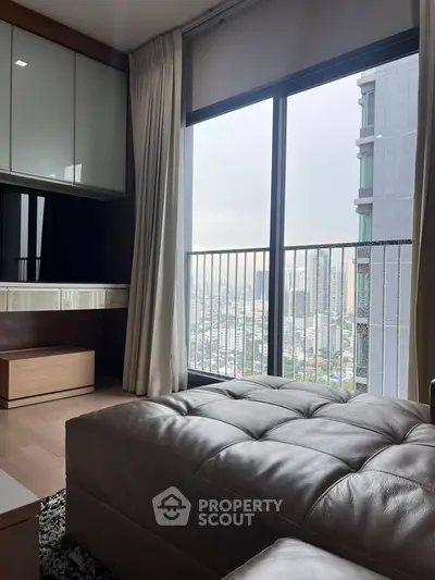 Modern apartment with city view from large window and cozy interior design.