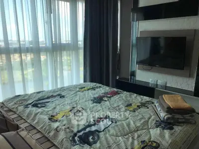 Modern bedroom with large window and wall-mounted TV, offering a cozy and inviting atmosphere.