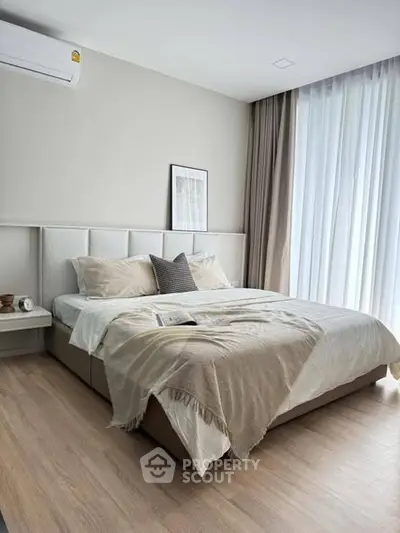 Modern bedroom with cozy decor and natural light