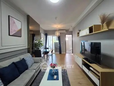 Modern living room with stylish decor, open layout, and natural light.