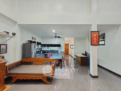 Spacious open-plan living area with modern kitchen and elegant decor