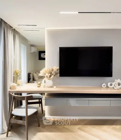 Modern living room with sleek TV setup and elegant decor