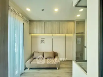 Modern living room with cozy sofa and elegant wood paneling