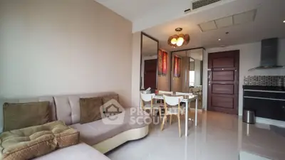 Modern living room with stylish furniture and open kitchen layout