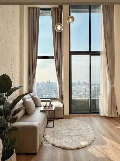 Luxurious living room with floor-to-ceiling windows offering stunning city views and elegant decor.