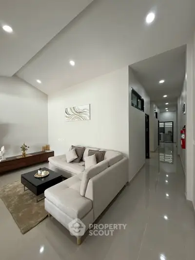 Modern living room with sleek design and cozy sectional sofa