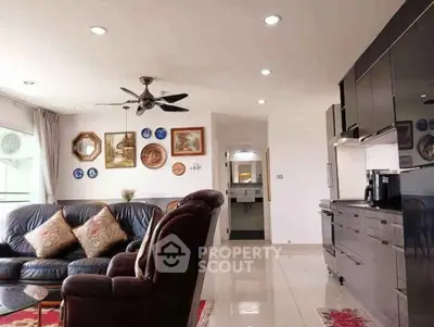 Spacious living room with modern kitchen and elegant decor
