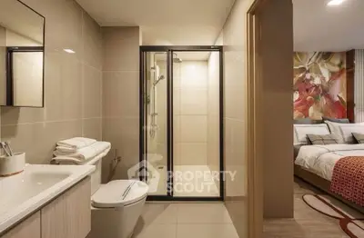 Modern bathroom with sleek shower and view into cozy bedroom