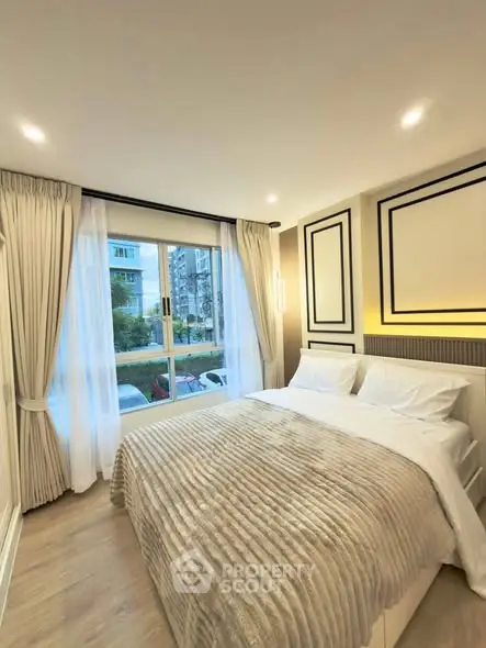 Luxurious bedroom with elegant decor and large window view