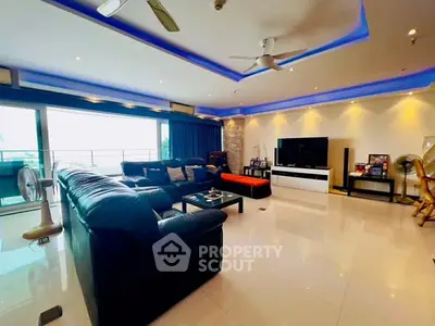 Spacious modern living room with sleek design and large balcony access.