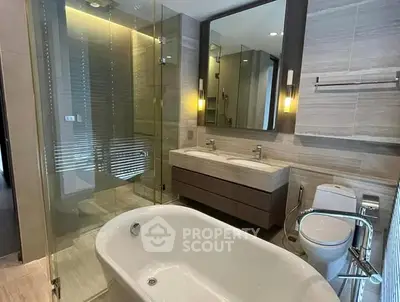 Luxurious modern bathroom with freestanding bathtub and dual sinks