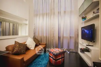 Chic modern living room with high ceilings, stylish decor, and cozy seating area.