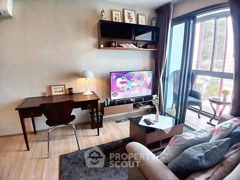 Modern living room with stylish decor and balcony view