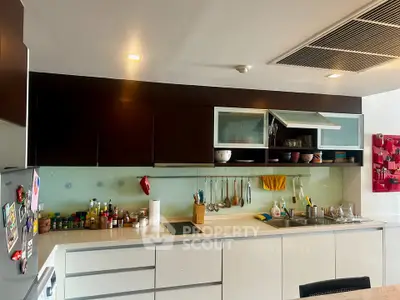 Modern kitchen with sleek cabinetry and integrated appliances, perfect for culinary enthusiasts.