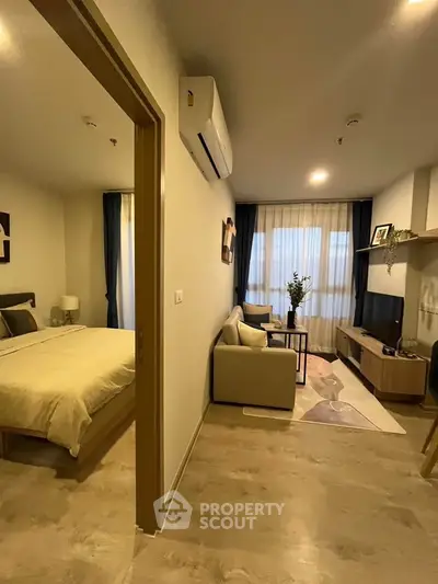 Modern apartment interior with cozy living room and bedroom, featuring stylish decor and natural lighting.