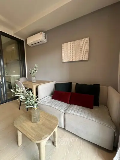 Modern living room with stylish decor and open kitchen layout