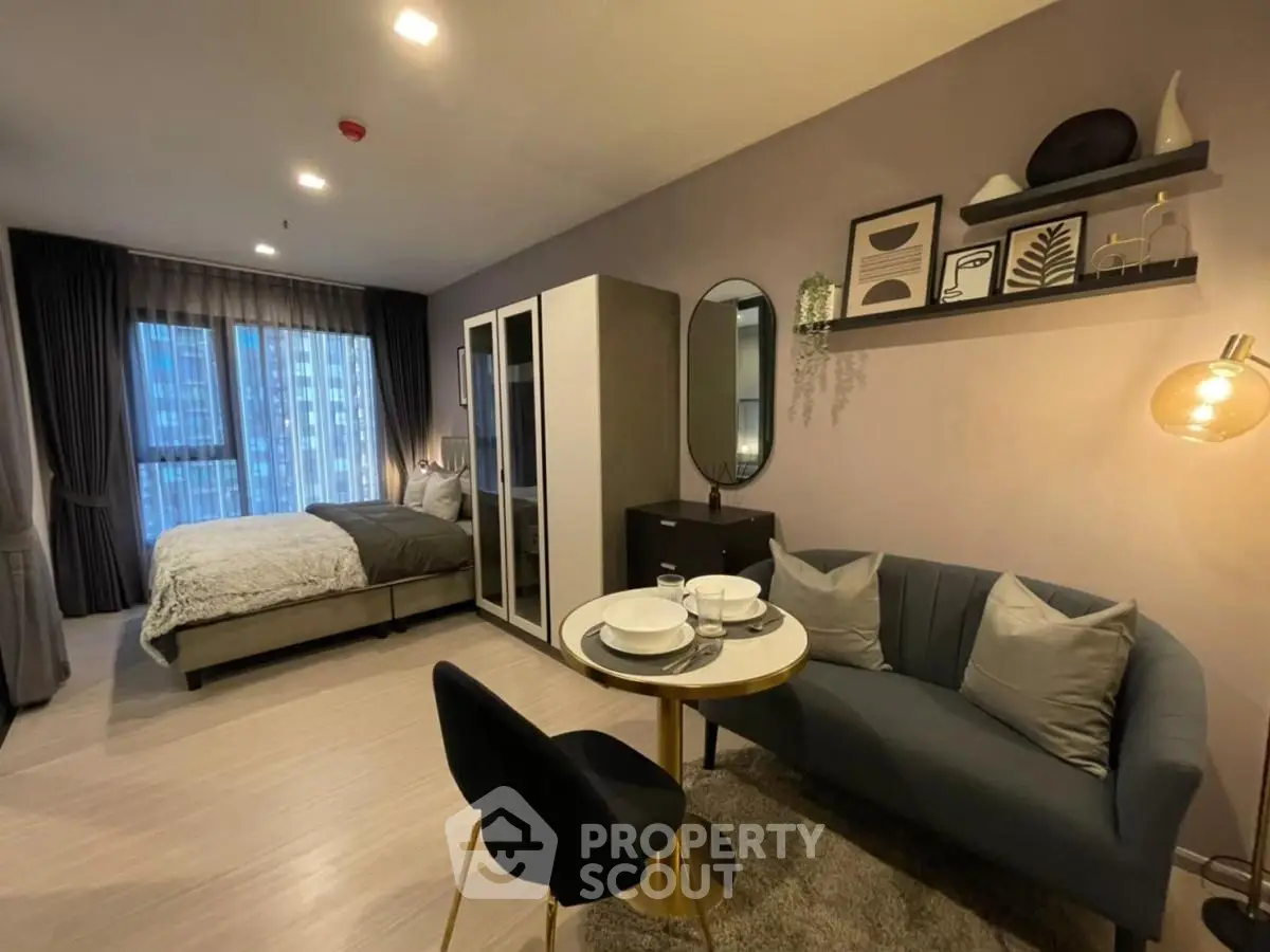Modern studio apartment with cozy living area and stylish decor