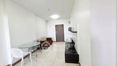 Spacious living room with modern furniture and sleek design in a contemporary apartment.