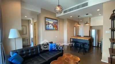 Modern living room with stylish decor and open kitchen layout