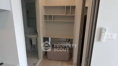 Modern apartment interior with sleek bathroom and stylish storage unit