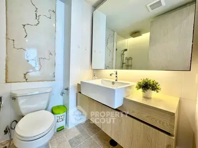 Modern bathroom with elegant fixtures and stylish lighting