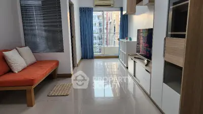 Modern living room with sleek furniture and large windows offering abundant natural light.