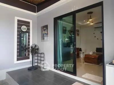 Modern living room with sliding glass door and stylish decor