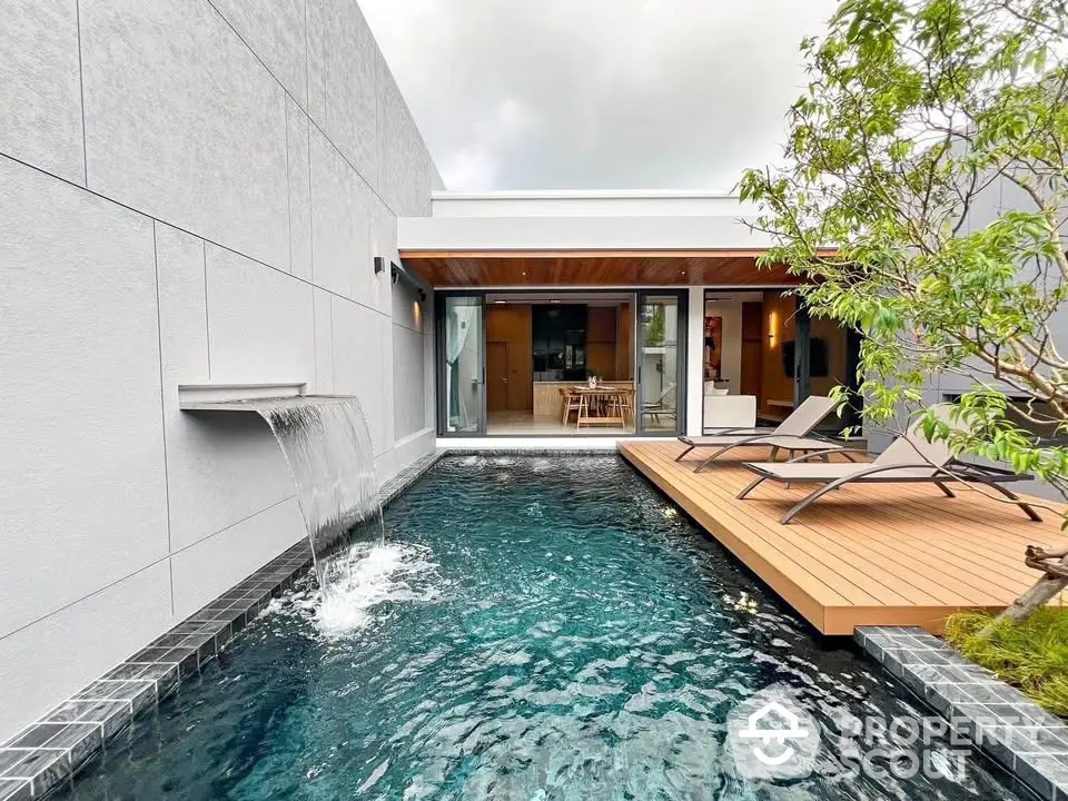 Luxurious modern home with private pool and wooden deck, perfect for relaxation and entertaining.