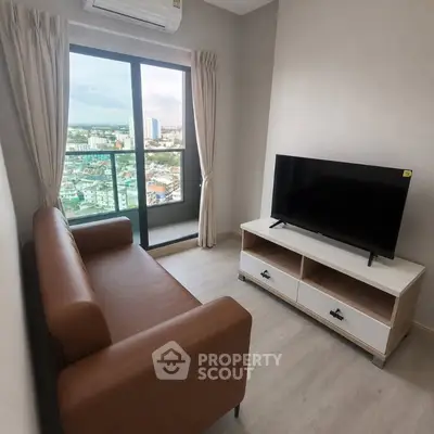 Modern living room with city view, featuring a sleek sofa and flat-screen TV, perfect for urban living.